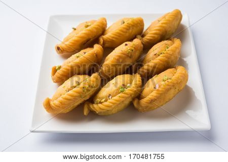Gujiya - sweet dumplings made during the festival of holi and diwali, selective focus