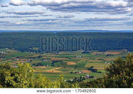 A mountain top view of farmland in the Kishacoquillas Valley of Mifflin County Pennsylvania United States.