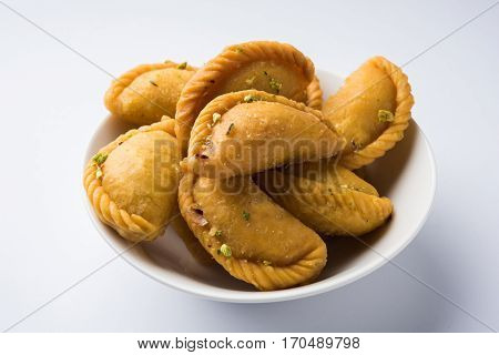 Gujiya - sweet dumplings made during the festival of holi and diwali, selective focus