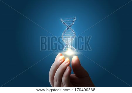 Dna In Hand On Blue Background.