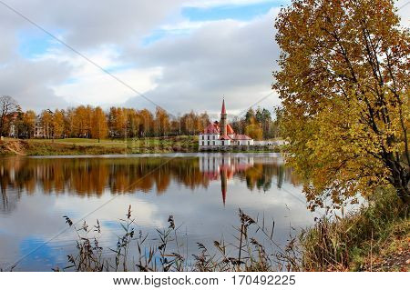 Beautiful romantic alley in a park with colorful trees and sunlight. autumn natural background. Gatchina
