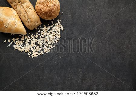 Bun of bread with oat flakes healthy meal for people on non gluten diet free space for typing text.