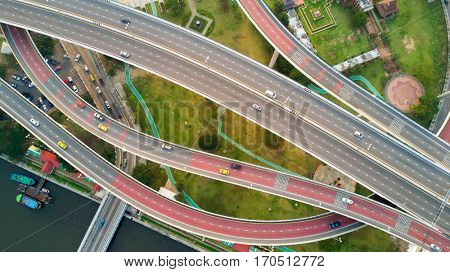 Top aerial view of a large road interchange at the Bhumibol bridge in Bangkok, Thailand