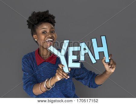 Smiling African Woman Holding Yeah Word