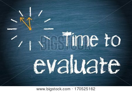 Time to evaluate - clock with text on blue background