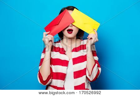 Surprised Woman With Two Envelopes