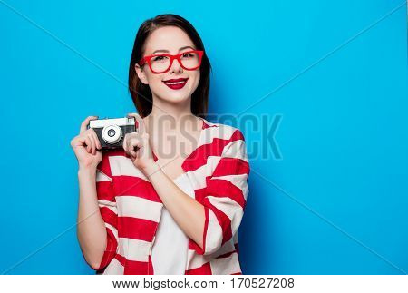 Young Smiling Woman With Retro Camera