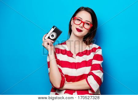 Young Smiling Woman With Retro Camera