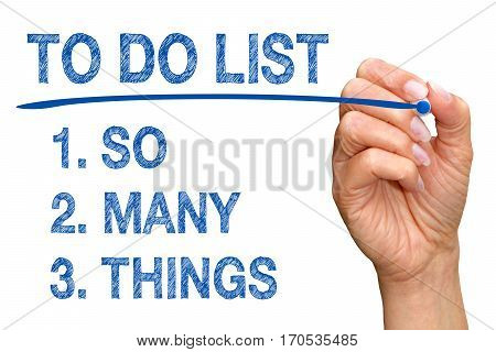 To Do List - So Many Things - hand with blue marker writing text on white background