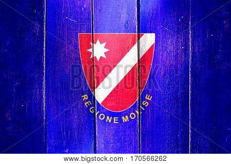 Vintage Molise flag on grunge wooden panel