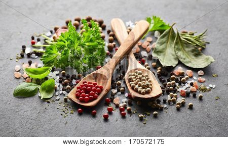 Spices and herbs on a black board