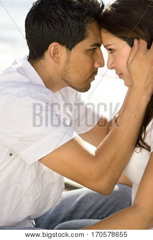 Portrait of a beautiful Hispanic couple laughing and smiling.