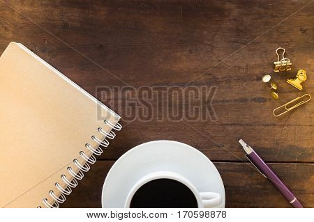 Hot cup of coffee on wooden work table stock photo