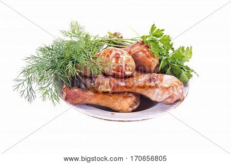 Portion of fried chicken drumsticks and vegetable garnish