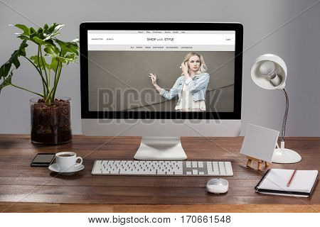 website frontpage against computer with personal organizer and belongings