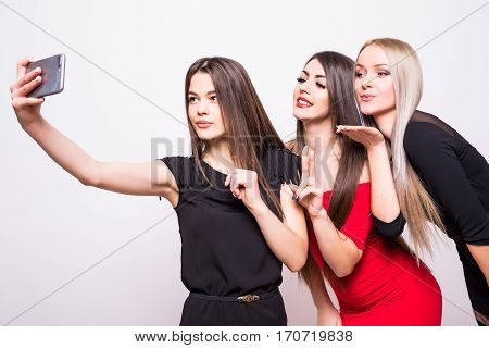 Three Models In Night Dresses Make Selfie On White