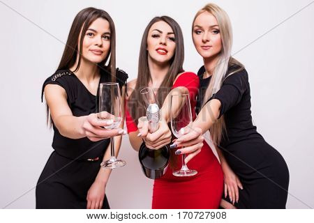Three Smiling Young Women Celebrating And Open Champagne On The Party