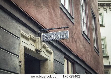 old library signboard on the threadbare building