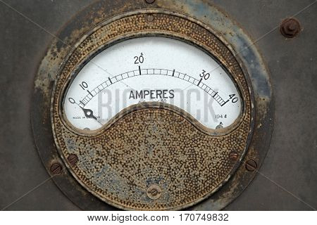 Old rusty ampere meter unit