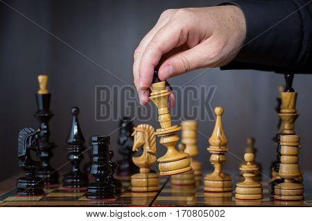 Game in chess. The chess player makes the move