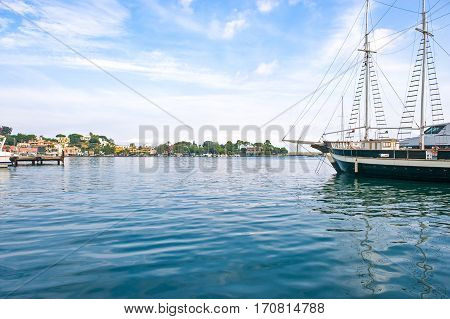 Italy, Ischia, Ischia Porto, a sailing boat in the harbor