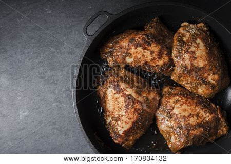 Butter Chicken in a sausepan on right on the table horizontal