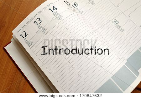 Introduction text concept write on notebook .