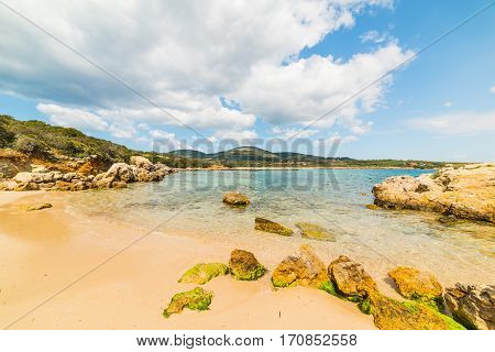 Rocks and sand in Alghero shoreline Sardinia