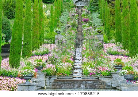 Flower garden and other plants a staircase and a waterfall on the island of Mainau (Lake Constance Germany)
