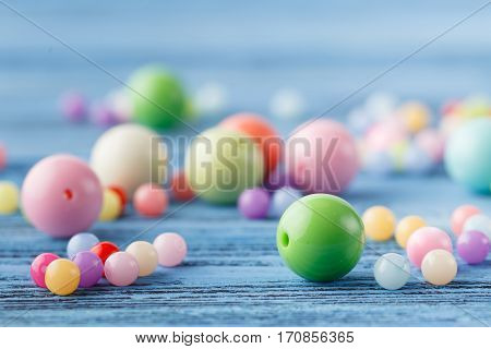 Few Beads On Blue Table, Jewerly Concept