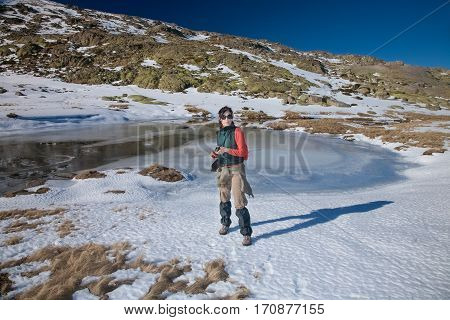 Hiker Woman Standing In Winter Snow