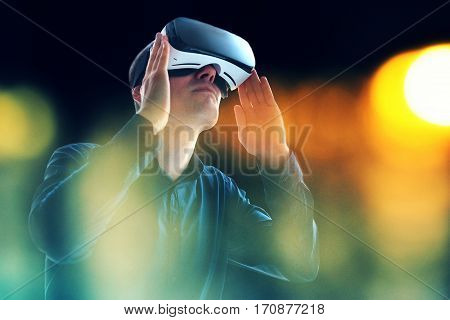 The man with glasses of virtual reality. Future technology concept. Modern imaging technology.