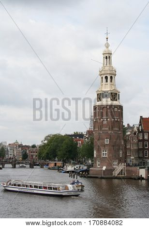 The Montelbaanstoren Is A Tower On Bank Of The Canal Oudeschans In Amsterdam