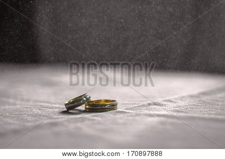 Wedding Love Concept. 2 Golden Wedding Rings On Textile Toned Background. Selective Focus
