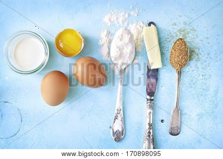 Ingredients For Baking - Eggs,flour,sugar,butter,milk.top View With Space For Text.