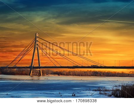 Moskovskyi (Moscow) bridge over stunning sunset in Kiev Ukraine
