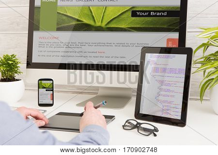 Designer's desk with responsive web design concept.