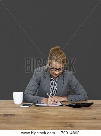 Businesswoman writing down a plan and strategy