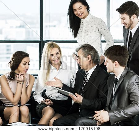 A group of businessmen discussing the policy of the company in the office.
