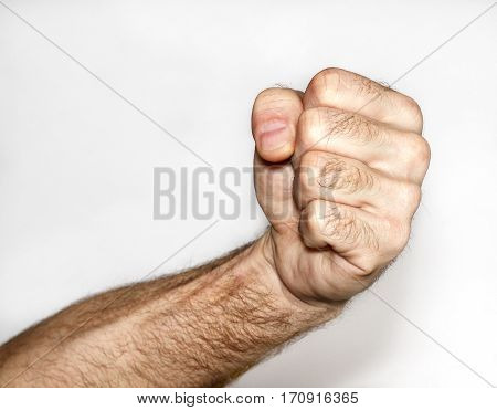 Male fist on a white background afternoon