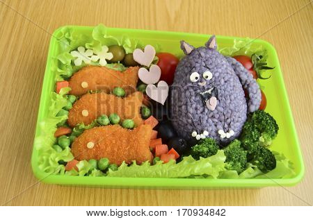 The cat is made of rice. Kyaraben, bento. Creative food for children.