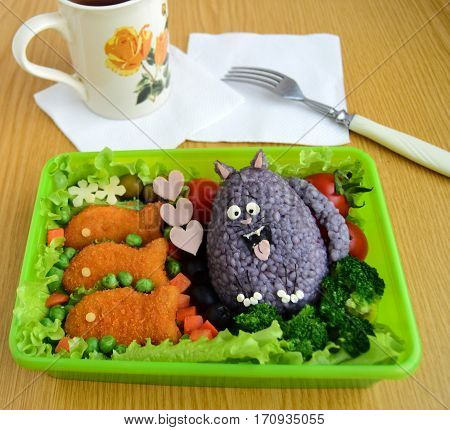 The cat is made of rice. Kyaraben, bento. Creative food for children.