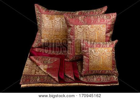 linens and pillows on a black background