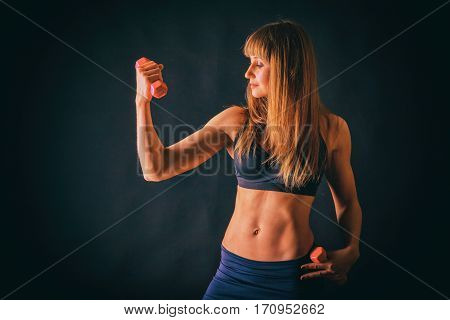 Sexual sports girl on a dark background.