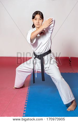Woman during training in karate. Fighting position active lifestyle