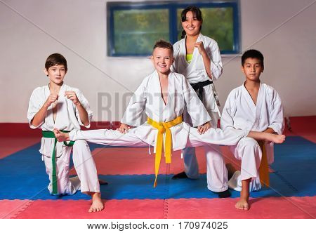 Children during training in karate. Fighting position active lifestyle practicing fighting techniques