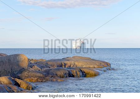 GRISSLEHAMN SWEDEN - JUL 12 2016: Passenger ferry rocky coastline and blue sea in the swedish archipelago. July 12 2016 Grisslehamn Sweden