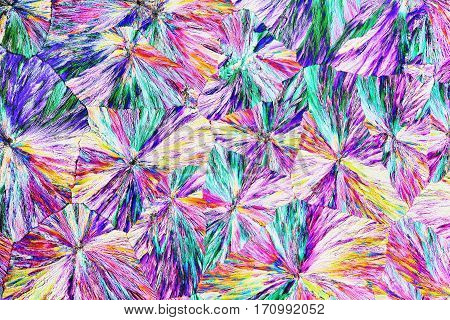 Colorful micro crystals through the microscope in polarized light