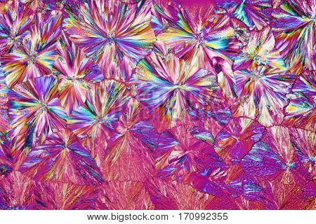 Colorful micro crystals through the microscope in polarized light