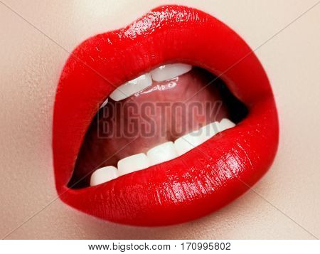 Cosmetics And Makeup. Red Lip Gloss And Lipstick. Fashion Lip Makeup. Sensual Female Mouth